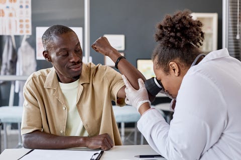 smiling black man visiting doctor