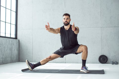 young men exercising in gym focusing on total body strength