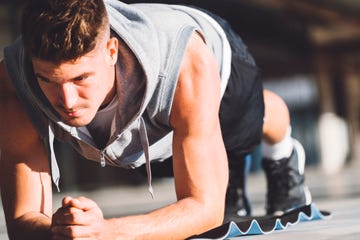 Fitness man doing plank position