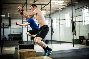gym - men doing box jumps