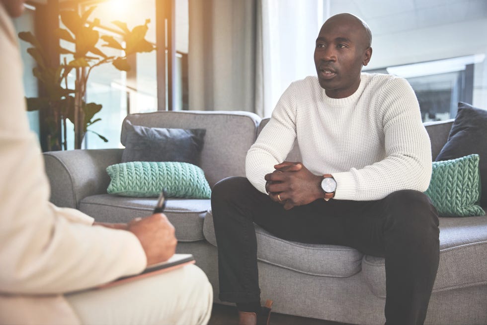 a man talking to a psychologist or therapist