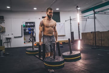 Muscular man working out in gym