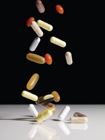 various supplements falling onto table toop