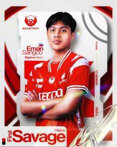 the soccer player is posing with his arms crossed in front of an advertisement for the team