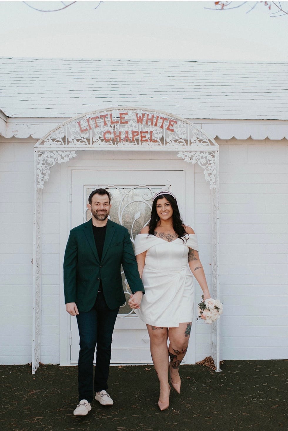 Doug and his wife holding hands in front of a chapel. Doug and his wife holding hands in front of a chapel.