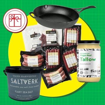 Cast iron skillet, various packaged meats, sea salt, and tallow on colorful background with gift icon. Cast iron skillet, various packaged meats, sea salt, and tallow on colorful background with gift icon.