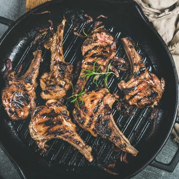 Barbecue dinner with grilled lamb meat chops in pan Barbecue dinner with grilled lamb meat chops in pan
