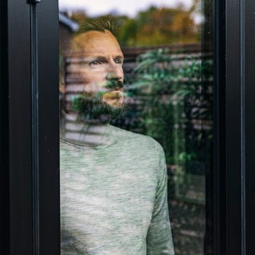 Man looking through window man looking through window