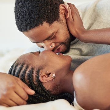 Shot of a young couple being intimate in bed at home shot of a young couple being intimate in bed at home