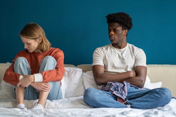 Unhappy young diverse couple sitting in silence in misunderstanding after quarrel, argument, scandal unhappy young diverse couple sitting in silence in misunderstanding after quarrel, argument, scandal