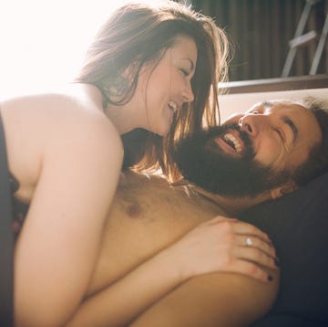 Young Beautiful Man With A Woman Sleeping In The Bed. View From Above. young beautiful man with a woman sleeping in the bed view from above