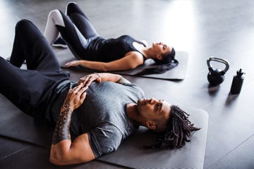 Young couple doing exercise in gym. young couple doing exercise in gym